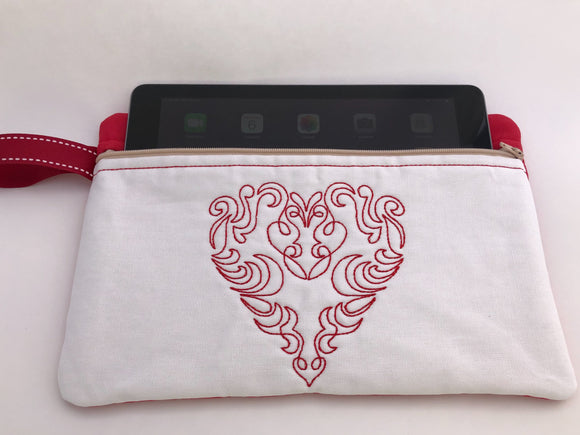 This is a iPad or tablet bag, designed, embroidered and handmade. It is made of cotton and shows who you are and what you care about.